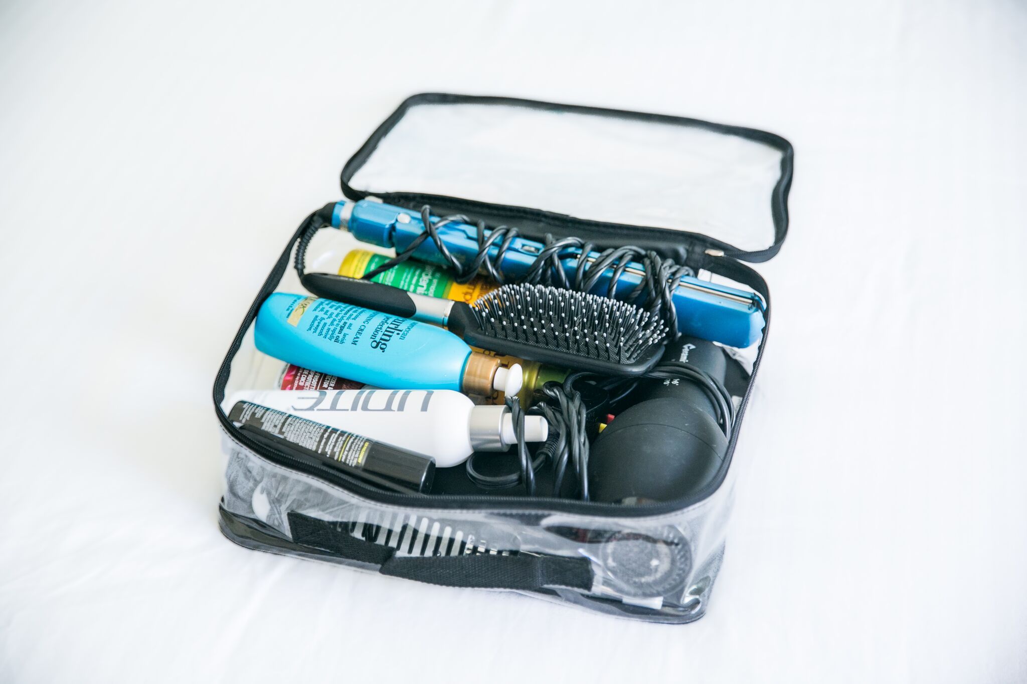 Medium packing cube with hair products and tools