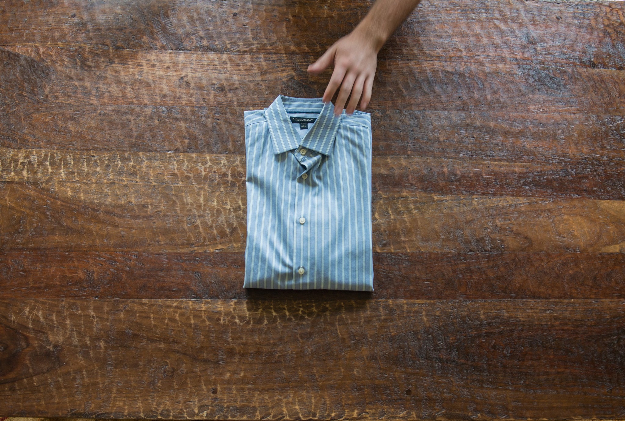 Perfectly folded dress shirt using EzPacking travel folding board
